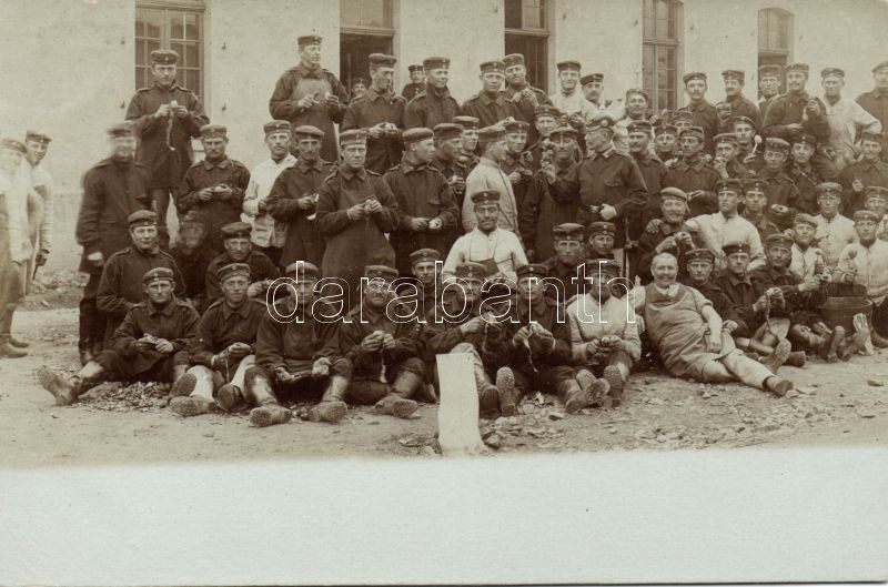 Soldiers peeling potatoes, photo