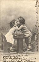 Kissing children couple