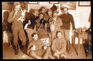 1915 Katonák szilveszteri mulatozása, a Tábori Postán keresztül küldött futott fotólap, M.kir. 41. Honvéd Gyalog Hadosztály számtisztjének pecsétjével, 14x9 cm / 1915 New Year, military photo from the world war I., 14x9 cm