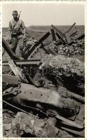 Bicycle soldier, overturned tractor, photo