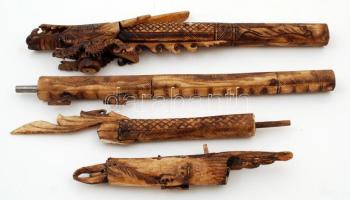 Csontból készült, gazdagon díszített, faragott indonéz fúvócső nyíltartó tokkal, kis sérüléssel, h: 104,5 cm /  Richly ornated, carved blowgun made from bone with case, a bit damaged, length: 104,5 cm