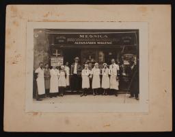 cca 1930-1940 Zágráb, Aleksander Miklenic mészáros üzletének bejáratánál, alkalmazottaival, kartonra kasírozva, pecséttel jelzett, fotó 23x17 cm, karton 31x24 cm / cca 1930-1940 Zagreb, Aleksander Miklenic butcher, stamp on the verso, photo 23x17 cm