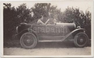 Lady in automobile, photo (small tear)