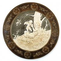 Schütz Cilli: Erdőn játszadozó faun és puttó, mázas kerámia dísz falitányér párban, jelzett, egyiken...