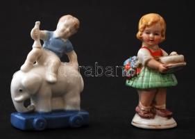 2 db porcelán figura(kislány ragasztott fejjel, elefánton lovagló kisfiú), m: 8 cm