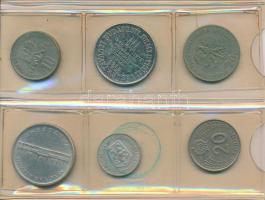 44db vegyes magyar és külföldi fémpénz és zseton kis albumban, közte érdekesebb darabok is! T:vegyes...