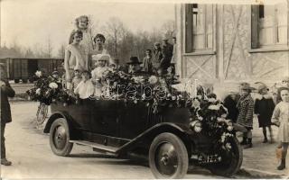 Automobile in festive decoration, beauty pageant (?) group photo