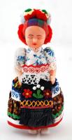 Kalocsai ruhába öltözött műanyag baba, saját tartójában