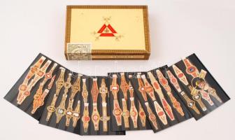 49 db különféle szivargyűrű berakókba rendezve, Monte Cristo Habana márkájú szivarosdobozban