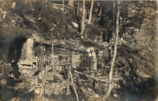 WWI K.u.K. military camp on the hill-side, shelters, Red Cross flag, photo