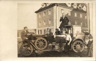 Vintage automobile, beer drinking men, photo
