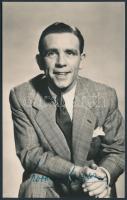 Sir Norman Wisdom (1915-2010) színész  saját kezű aláírása egy őt ábrázoló fotón, 13x8cm/ Signature ...