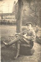 WWI Austro-Hungarian soldier reading a newspaper, photo