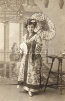 Lady dressed as Japanese women in a photo studio, photo