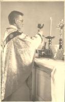Priest with communion wine, photo