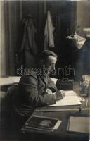 Unknown location, soldier at his desk, probably an officer (no visible rank insignia), photo