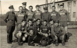 ~1950 Futball játékosok Újpesti Dózsa feliratú mezben, egyenruhások társaságában / ~1950 Football players in Újpest Dózsa colours, accompanied by men in uniform, photo