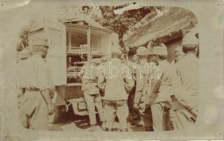 Mentőautót szemlélő K.u.K katonák csoportképe, valószínűleg I. világháború idején / Austro-Hungarian soldiers inspecting an ambulance car, probably WWI, photo (tűnyomok / pinholes)