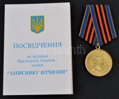 Ukrajna 1999. A haza védelmezője emlékérem tombak kitüntetés mellszalagon, igazolvánnyal T:1- Ukraine 1999. Defender of the Motherland Medal tombac decoration on ribbon, with certificate C:AU