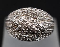 Női ezüst(Ag) gyűrű apró kövekkel díszítve, jelzett, méret: 54,  nettó: 5,6 g