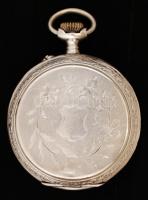 Gazdagon díszített ezüst (Ag.) zsebóra, jelzett, a belső fedele fém, működik, bruttó 65,8 g