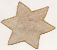 cca 1944 Ruhára varrható, szövet sárga csillag, hátoldalán szláv 'zsidó' felirattal, talán...