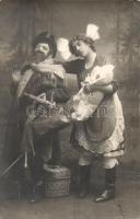 Man with doctor's bag with a men dressed as woman, humour, photo (EK)