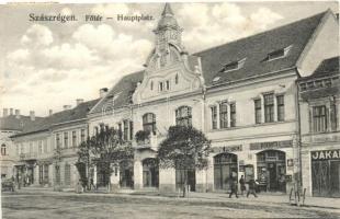 Szászrégen, Reghinul-sasesc; Főtér, Hauptplatz. Bischitz J. kiadása / main square, shops (apró szakadás / small tear)