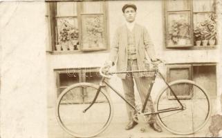 Man with bicycle (surface damage)