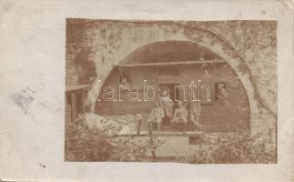 K.u.K. katonák egy pincéből kialakított barakk előtt, a hátoldalon tábori pecsételéssel, I. világháború / Austro-Hungarian soldiers standing before a cellar converted to barracks, field post cancellation on backside, WWI, photo (EB)