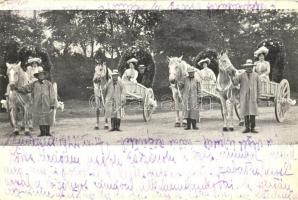 Ladies in horse carriage with flower decoration, flower festival(?) (EK)