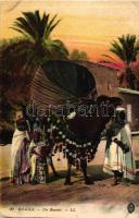 Biskra, Un Basour / camel, people in traditional dresses, Algerian foklore (EK)
