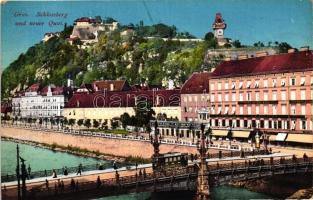 Graz, Schlossberg und neuer Quai / castle, bridge with tram, the new quay, shops (EK)