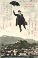 Salzburg, flying man with umbrella, general view with the castle (EK)