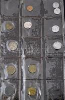 130db-os vegyes külföldi fémpénz gyűjtemény klf országokból sérült albumban, közte Tanzánia, Mongóli...