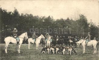 Hunters on horses with hunting dogs