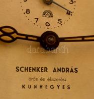 "Schenker András Kunhegyes" feliratú fém ébresztőóra, fluoreszkáló számlappal, kopásnyomok...