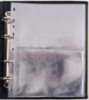 Használt, kék Leuchtturm négygyűrűs "Coin Sets of all Nations" mappa, 11db nagyrészt sérül...