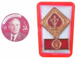 NDK 1969-1990. "A szocialista munka aktivistája" zománcozott fém jelvény, műanyag tokban + ~1985-1991. "Perestroika" műanyag kitűző Gorbacsov fényképével (32mm) T:2 GDR 1969-1990. "Aktivist der sozialistischen Arbeit" enamelled badge in plastic case + ~1985-1991. "Perestroika" plastic badge with the picture of Gorbachev (32mm) C:XF