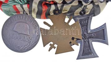 Német Birodalom 1914. "Vaskereszt 2. osztály" kitüntetés mellszalaggal + Német 3. Birodalom 1934. "Első Világháborús Érdemkereszt 1914-1918" kitüntetés mellszalagon harcolóknak, hátoldalán "OULC?" jelzéssel + Magyarország 1929. "Magyar Háborús Emlékérem kardokkal, sisakkal" ezüstözött Br kitüntetés mellszalaggal, "BRONZ" fémjel a koszorú alatt; mindhárom kitüntetés összevarrva, szalagsávok egyben kis fém csaton, két miniatűr kard rajtuk, egyik kissé hajlott T:2 German Empire 1914. "Iron Cross 2nd class" decoration with ribbon + German Third Reich 1934. "The Honour Cross of the World War 1914-1918" decoration with ribbon for combatants with "OULC?" mark on back + Hungary 1929. "Hungarian Commemorative War Medal with swords and a helmet" silver plated Br decoration with ribbon, hallmark below wreath; all three medals are sawn together, with thin ribbons, two miniature swords on thin ribbon, one slightly bent  C:2
