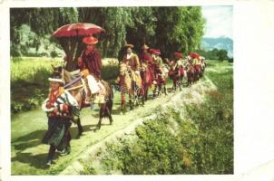 Tibetan horsemen in traditional costume on their way to horse-racing and archery contests (from postcard booklet) (EB)