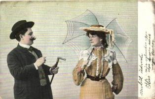Lady with umbrella, gentleman in hat (EB)