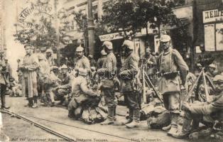 Warsaw, Warszawa, Warschau; rastende deutsche Truppen auf der Ujazdow-Allee / WWI resting German troops on the street, shops, from postcard booklet (kis szakadás / small tear)