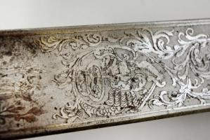 1899 Katonai szolgálat kezdetére készített, díszes vésésekkel ellátott tiszti kard. A pengében grafi...