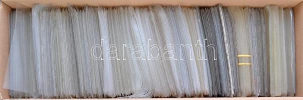 Egy doboznyi (kb. 1500 db) műanyag képeslaptartó tok / A box of plastic postcard holder cases, Cca. 1500 pieces