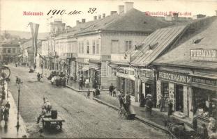 Kolozsvár, Cluj; Wesselényi Miklós utca, Fuhrmann Károly fűszerkereskedése, Kádár Endre cipő nagyáruháza,  Hübschmann M., Gráf József, Ellek I., Hirsch Adolf üzletei, Fabritius Erik és Társa kiadása / street, grocery, shoe store, shops (EK)