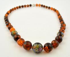 Kerek szemű borostyán nyaklánc, néhány szemen levonóképes díszítéssel / Amber necklace with round pickles 62 cm