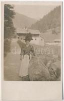 Unidentified village in the mountains, Lady with fancy hat, photo