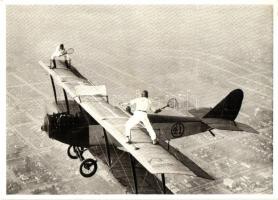 1925 Ivan Unger and Gladys Roy playing tennis on wings of airplane in flight. Modern postcard