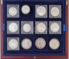 Vegyes 24db-os olimpiai témájú forgalmi ezüst emlékpénz gyűjtemény fa díszdobozban, 17klf ország érméi 1974-2010 közötti időszakból T:1,1-,PP / Mixed 24pc of Olympic themed commemorative silver coins in wooden display case, 17 different country, between 1974-2010. C:UNC,AU,PP